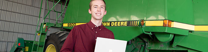 Student holding a laptop